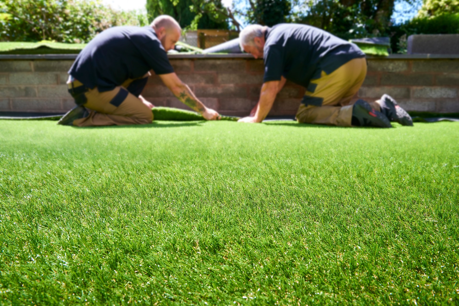 Fake grass installation team